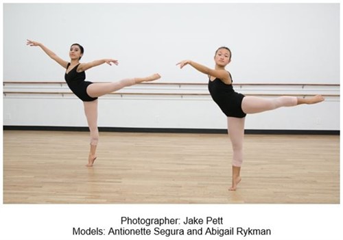 Two dancers in arabesque